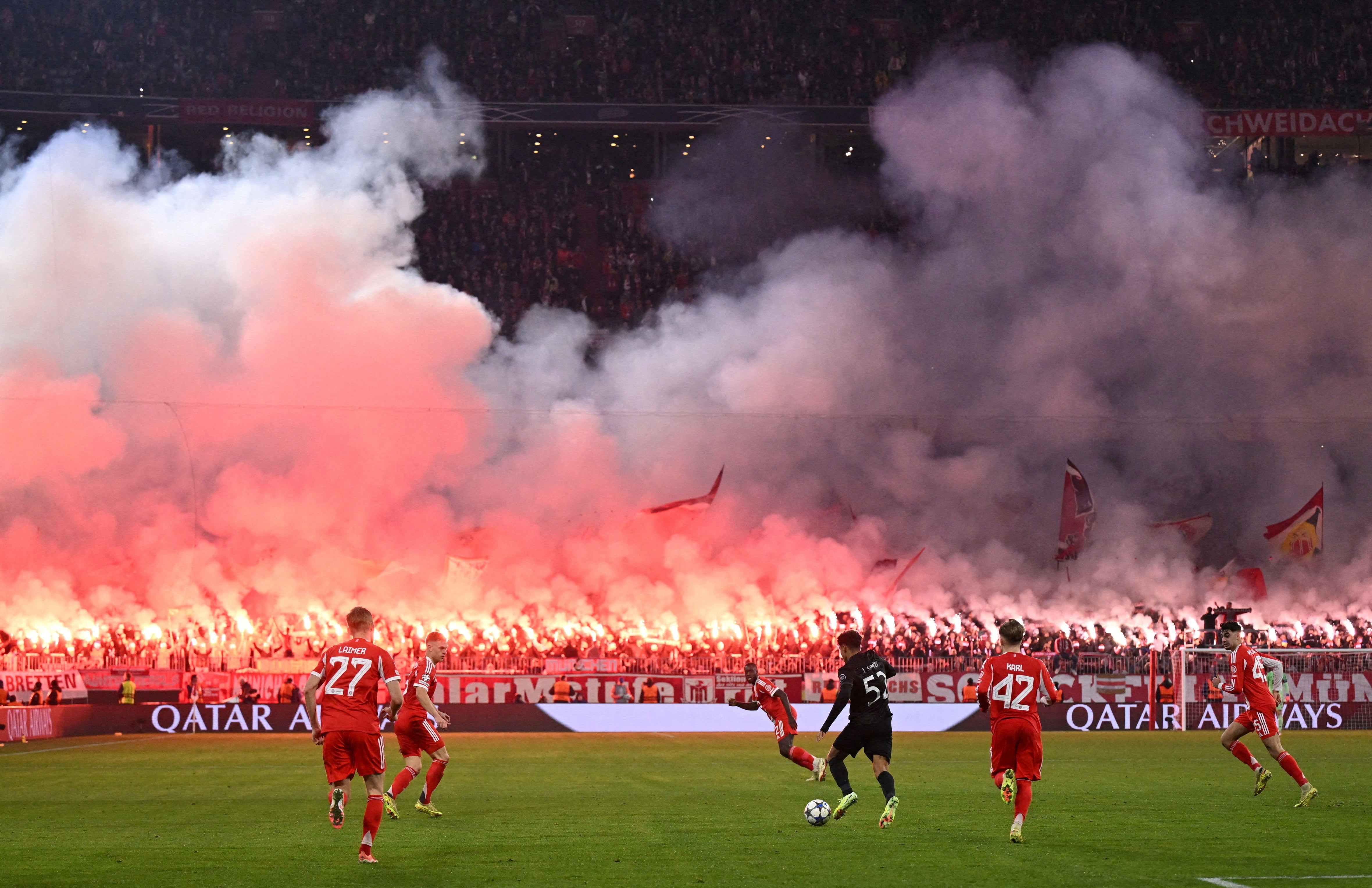 <p>Fireworks were set off in the stands by Bayern fans</p>