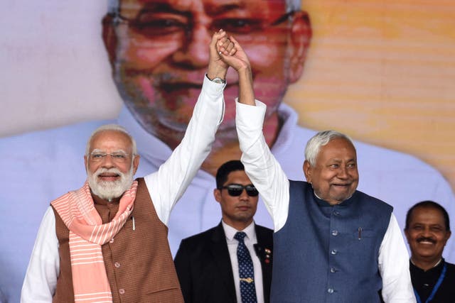 <p>India’s prime minister Narendra Modi, left, poses for pictures with Bihar chief minister Nitish Kumar in Patna on 20 November 2025</p>