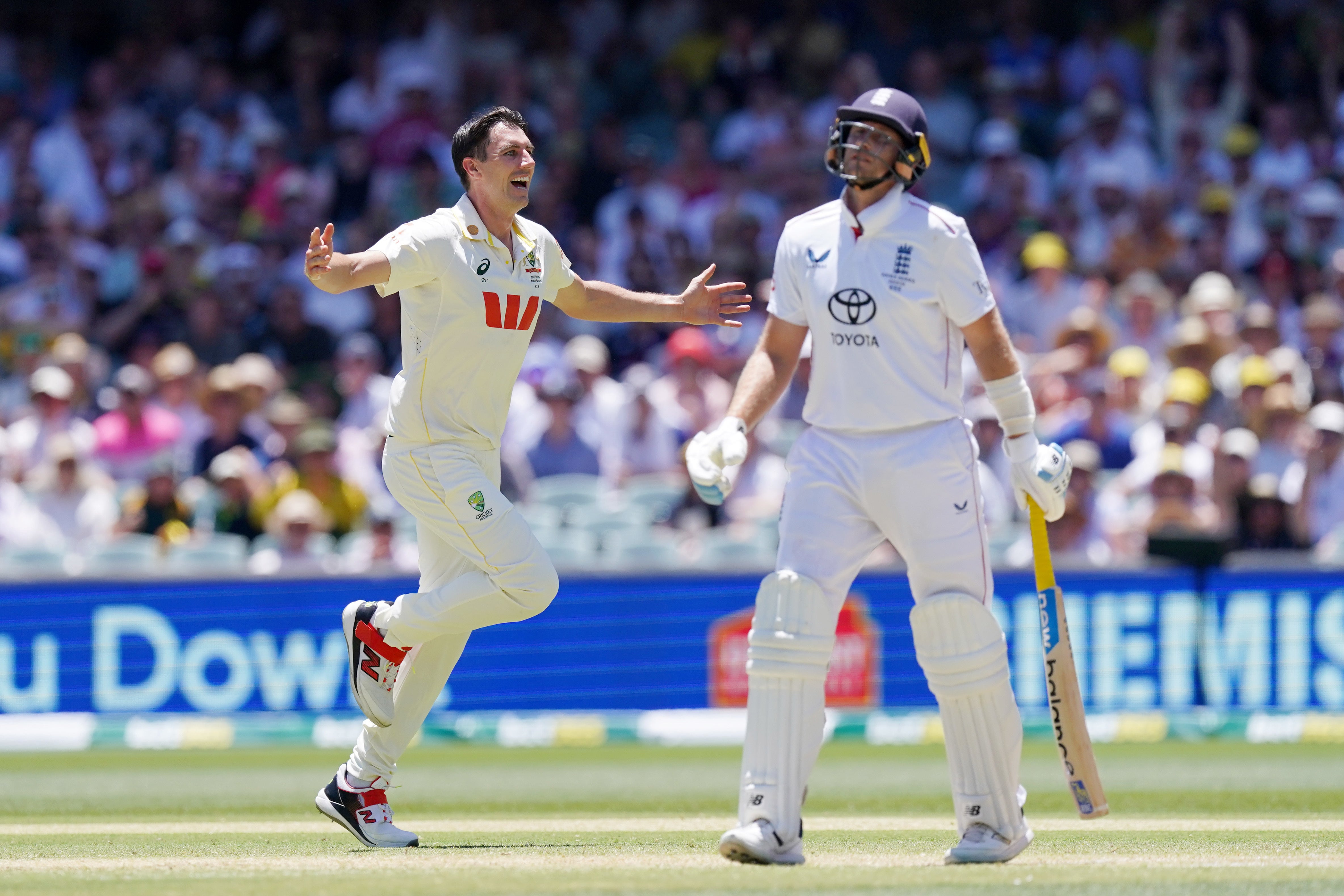 Australia captain Pat Cummins celebrates the wicket of Joe Root (Robbie Stephenson/PA)