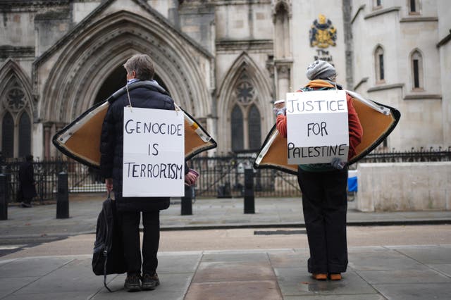 <p>Campaigners outside the Royal Courts of Justice, central London, in November</p>