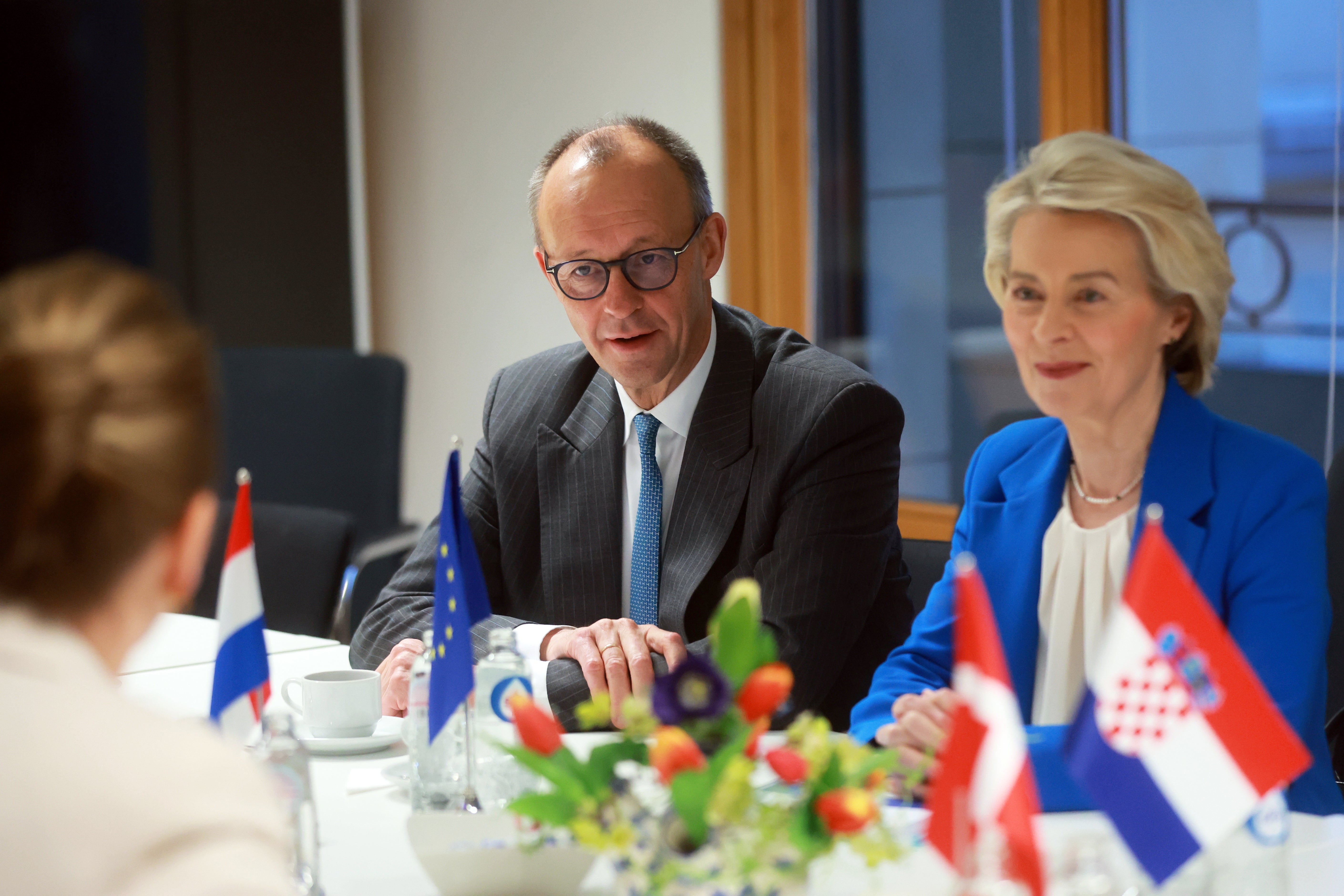 The president of the European Commission, Ursula von der Leyen and the German chancellor Friedrich Merz attend a meeting on immigration at the EU summit in Brussels