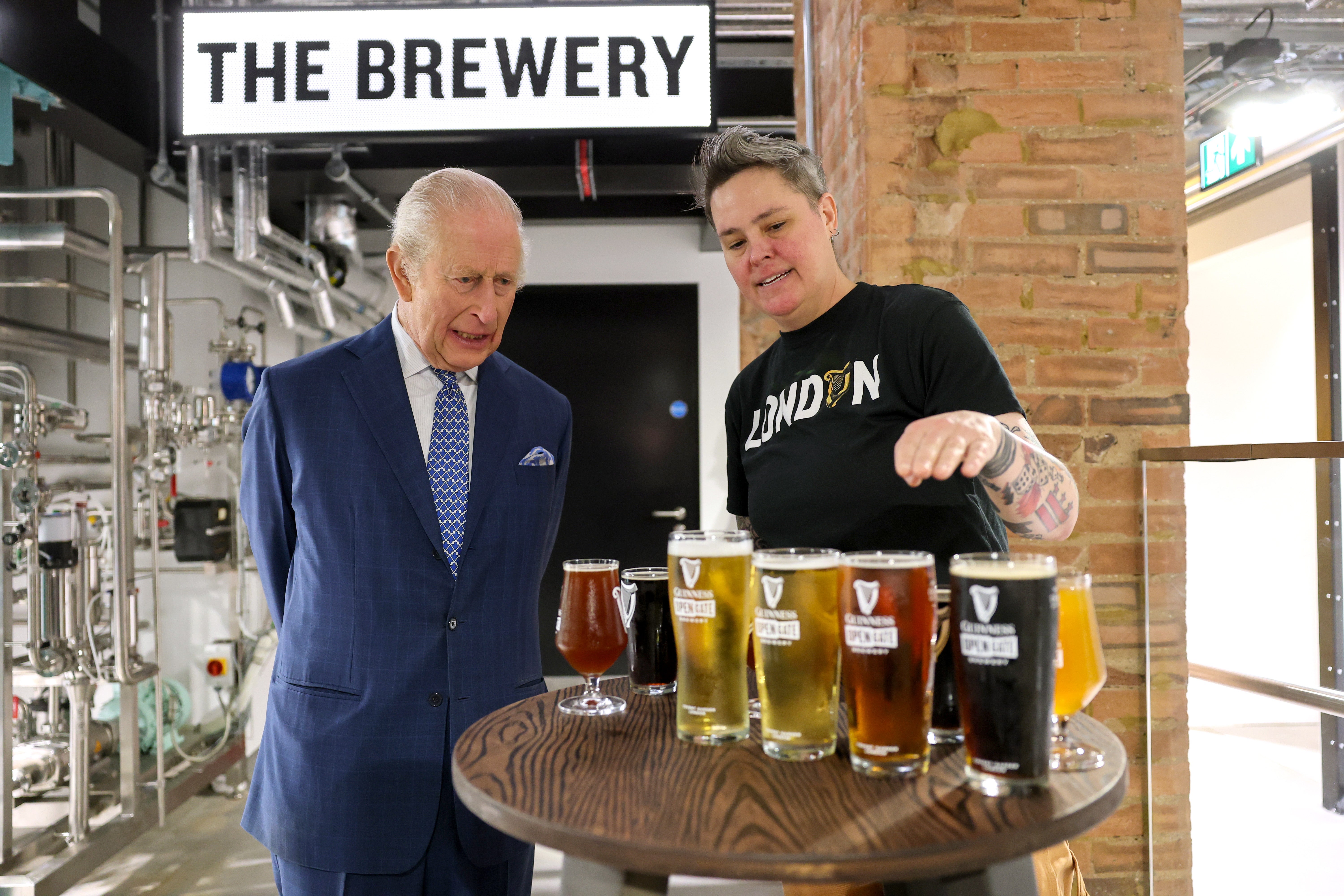 Charles was shown a range of beers brewed by Hollie Stephenson, master brewer at the Guinness Open Gate Brewery London (Chris Jackson/PA)