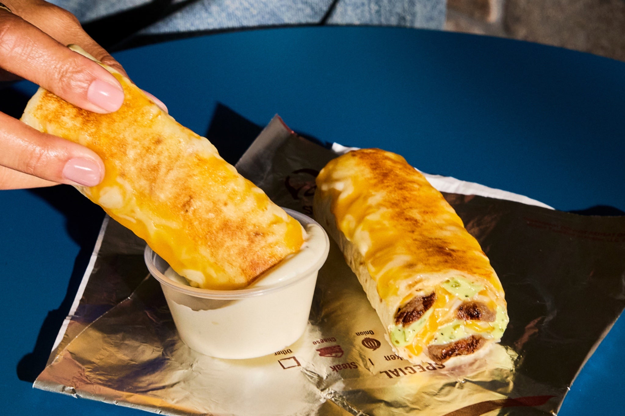 Taco Bell is bringing back the Cheesy Dipping Burritos in its new menu lineup