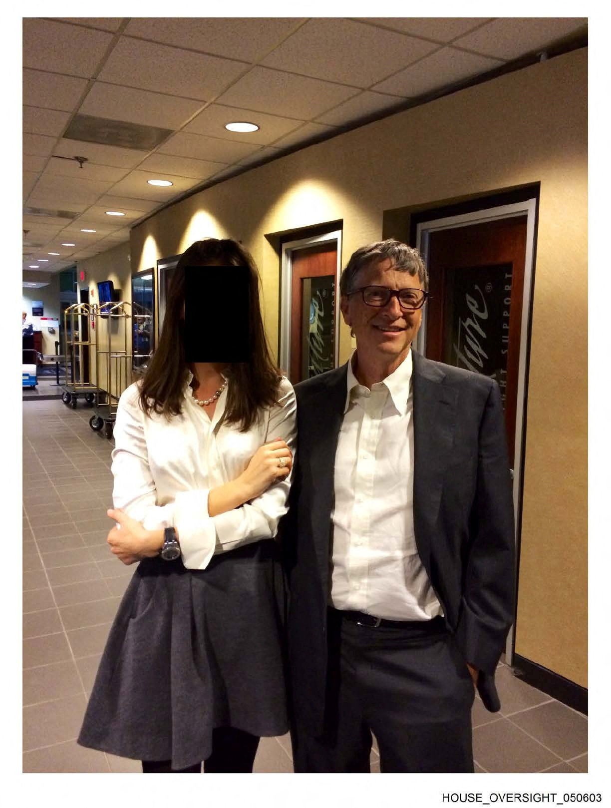 Gates appears with a woman, whose identity has been obscured, in this image from the Epstein estate released by the committee