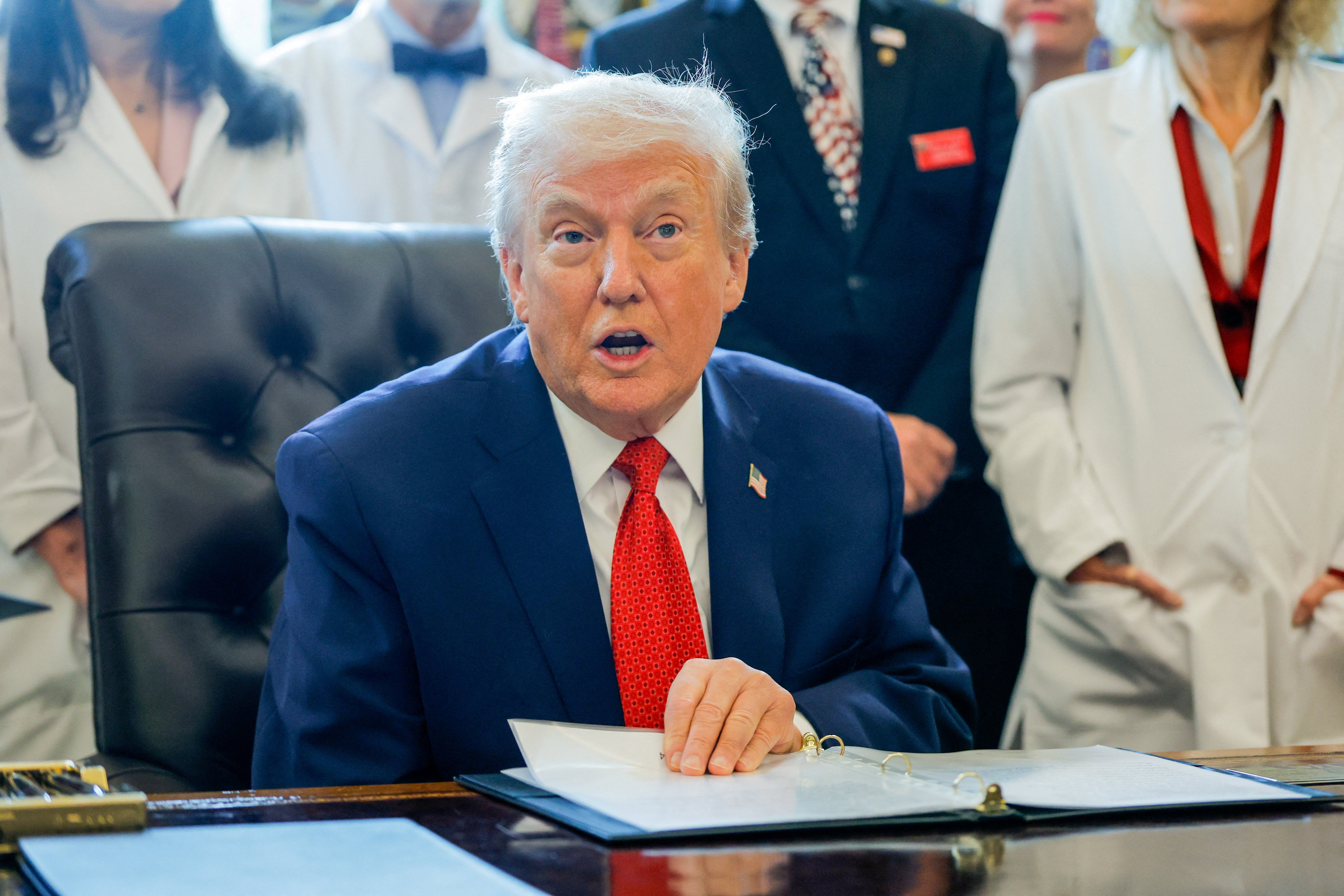 <p>President Donald Trump sits in the Oval Office to sign executive orders, including one regarding marijuana. </p>