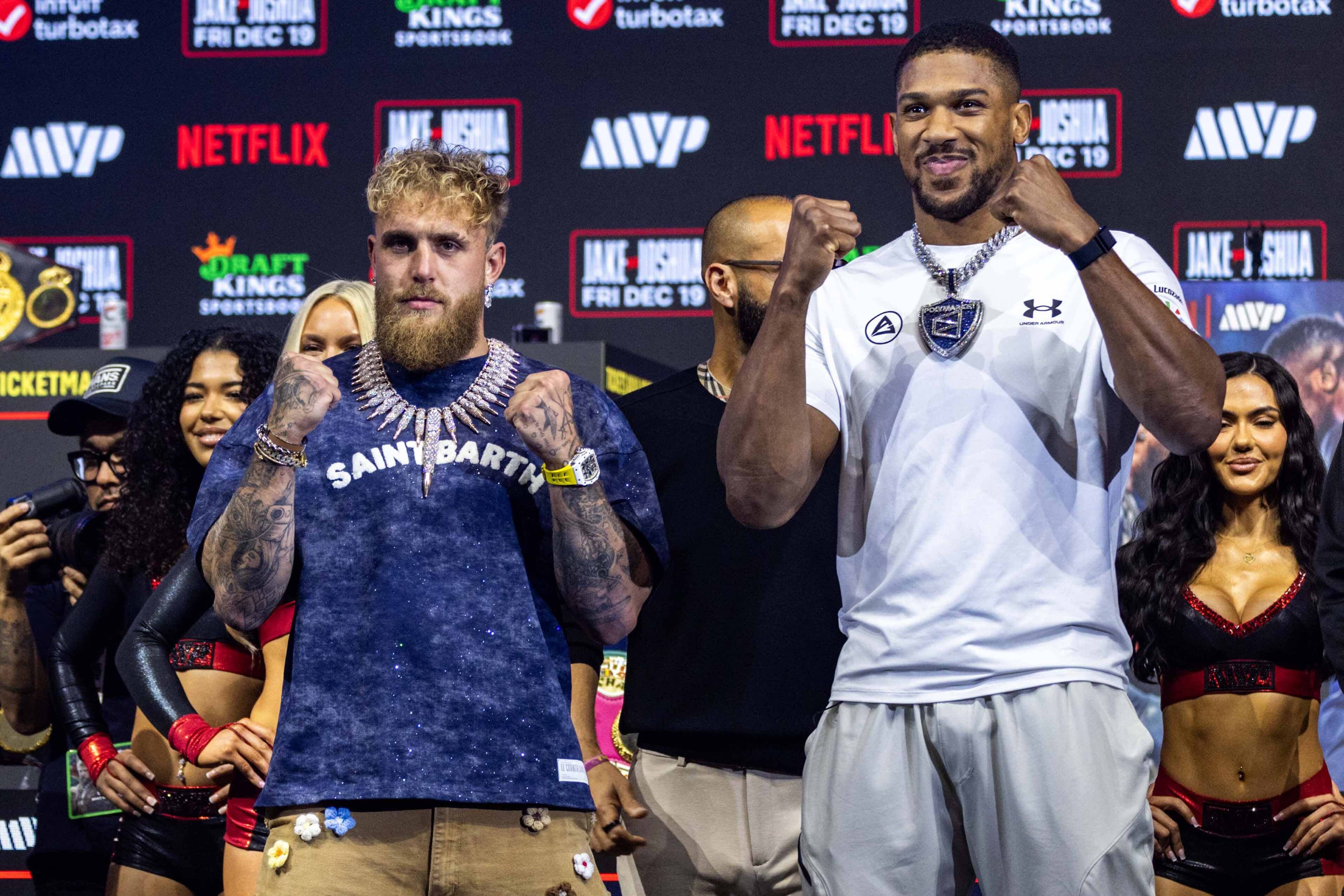 Jake Paul and Anthony Joshua face-off in Miami (D.A Varela/PA)