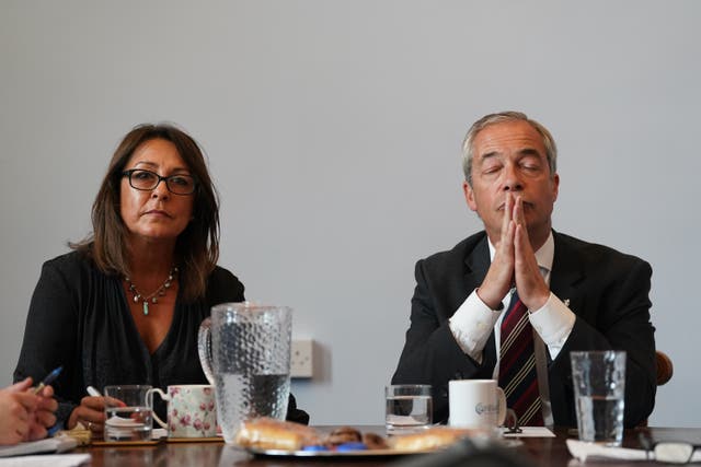 <p>Reform UK leader Nigel Farage attends a meeting alongside the head of Kent County Council, Linden Kemkaran (left)</p>