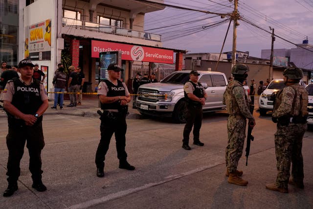 <p>Police stand guard following the shooting of Mario Pineida</p>