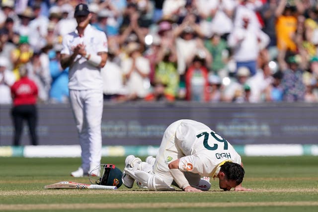 Australia batter Travis Head kisses the ground to celebrate reaching his century (Robbie Stephenson/PA)