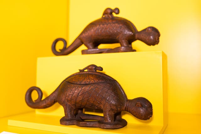 <p>Two carved wooden animal vessels at the Africa Hub</p>