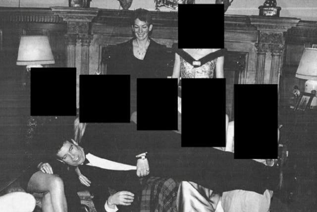 <p>The photo released by the US Department of Justice appears to show Andrew Mountbatten-Windsor reclining across the laps of five people</p>