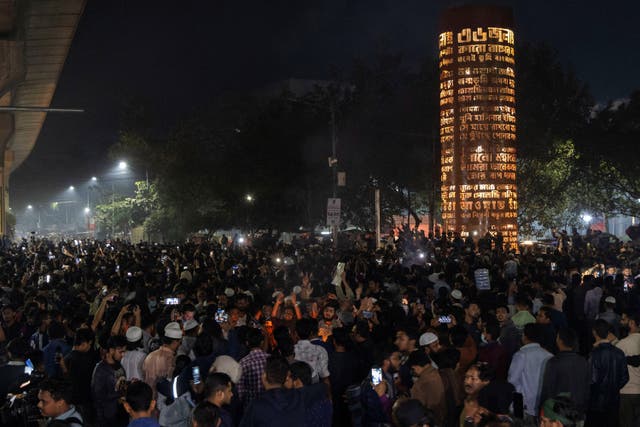 <p>People gather following the death of Sharif Osman Hadi in Dhaka</p>