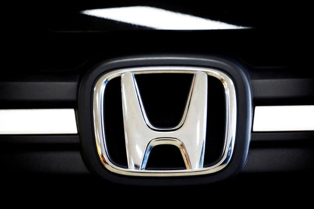 <p>A logo of Honda is seen inside a car dealer in Nijmegen</p>