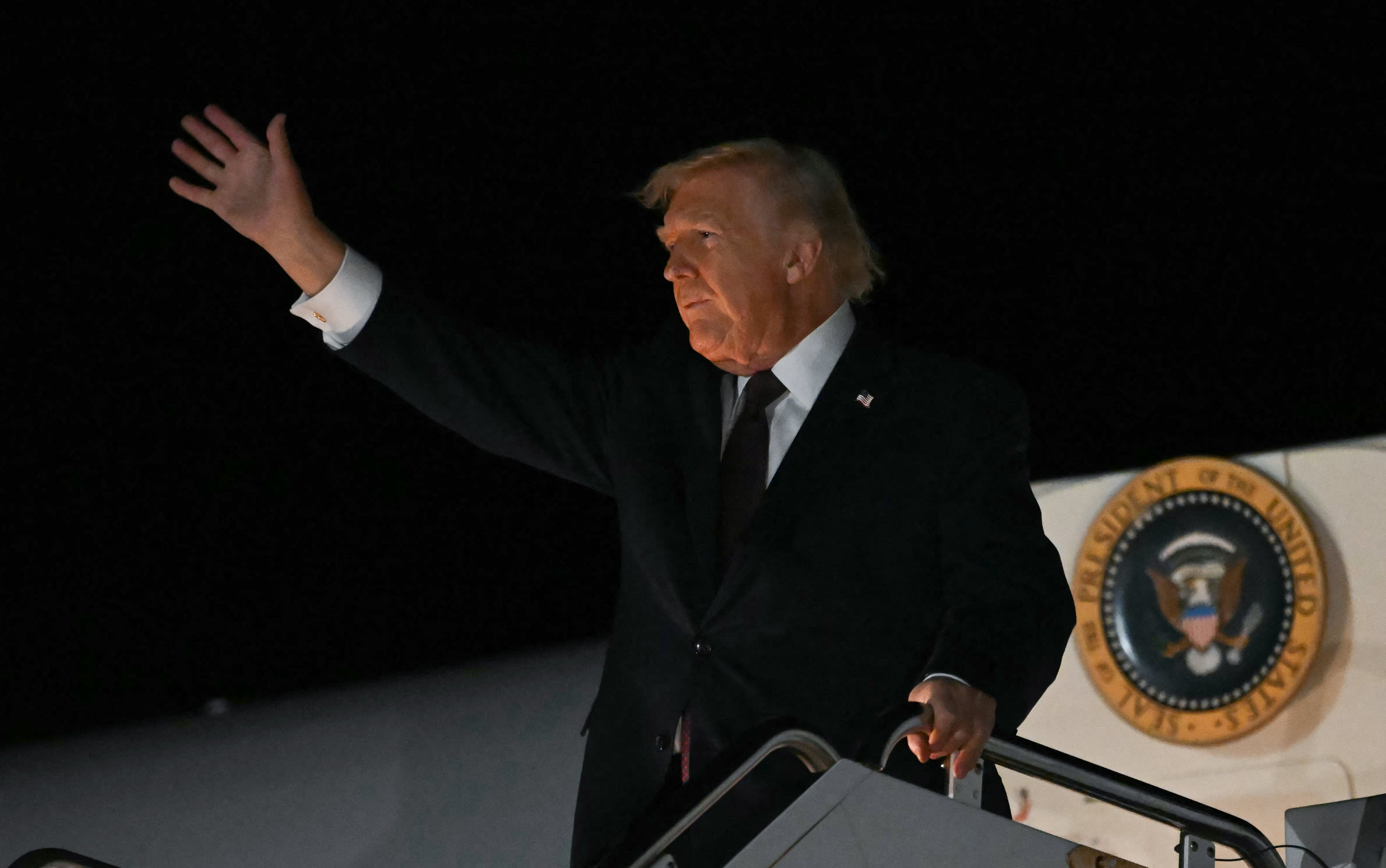 President Donald Trump steps off Air Force One upon arriving at Rocky Mount Wilson Regional Airport in Elm City, North Carolina, Friday