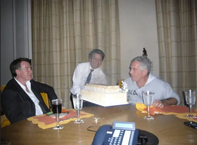 <p>Peter Mandelson and Jeffrey Epstein around a large cake</p>