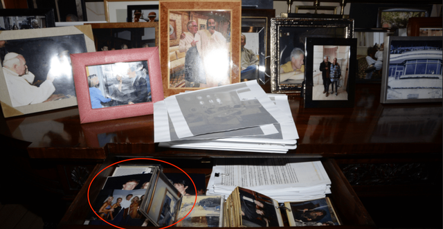 <p>The photograph of Jeffrey Epstein’s desk, where blurry images appear to show Donald Trump, were among the files removed by the Department of Justice without explanation</p>