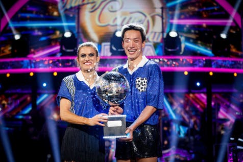 <p>Karen Carney and Carlos Gu with their trophy after winning the 2025 series of Strictly Come Dancing (Guy Levy/BBC/PA)</p>