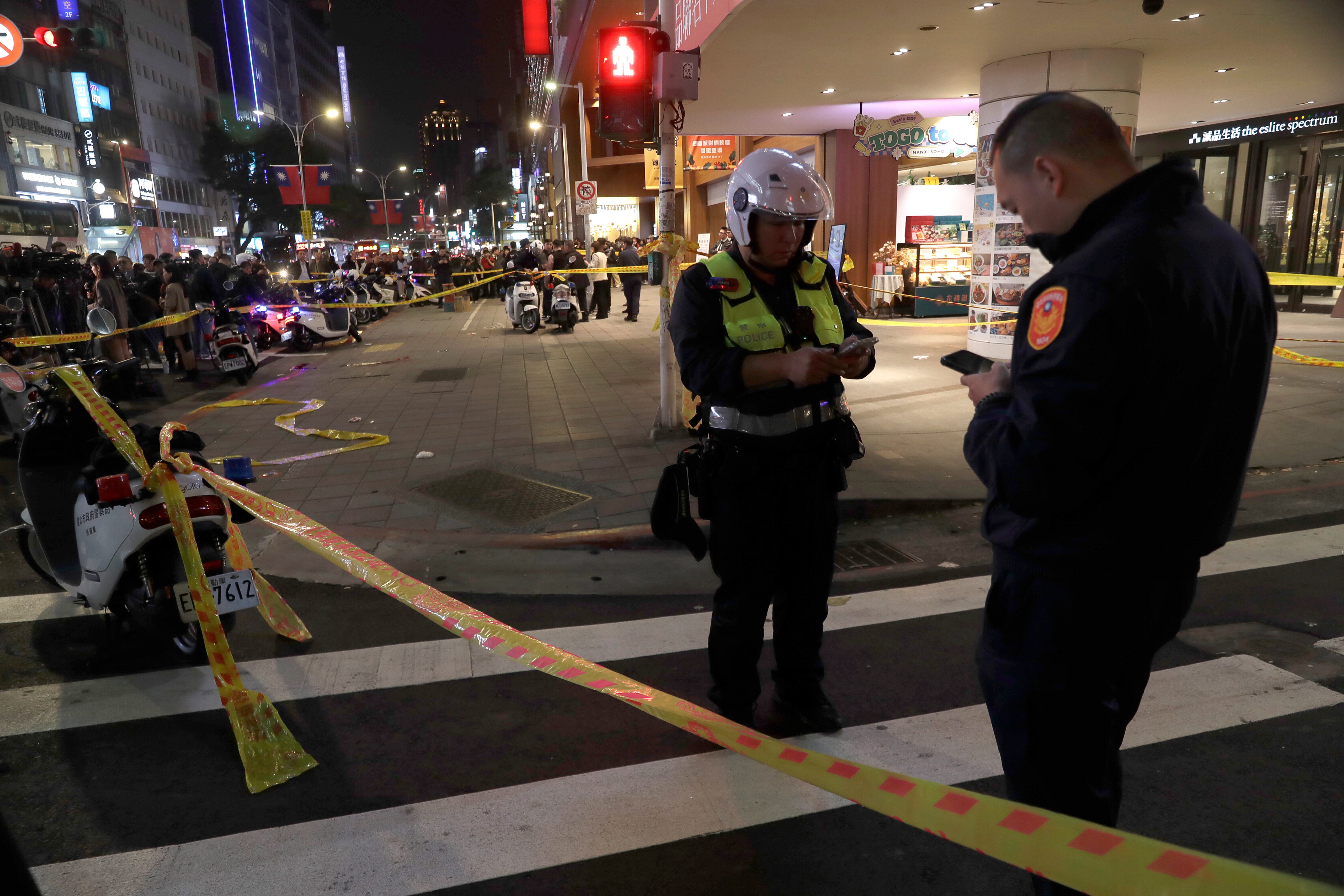 Taiwan police cordoned off the scene after a knife attack