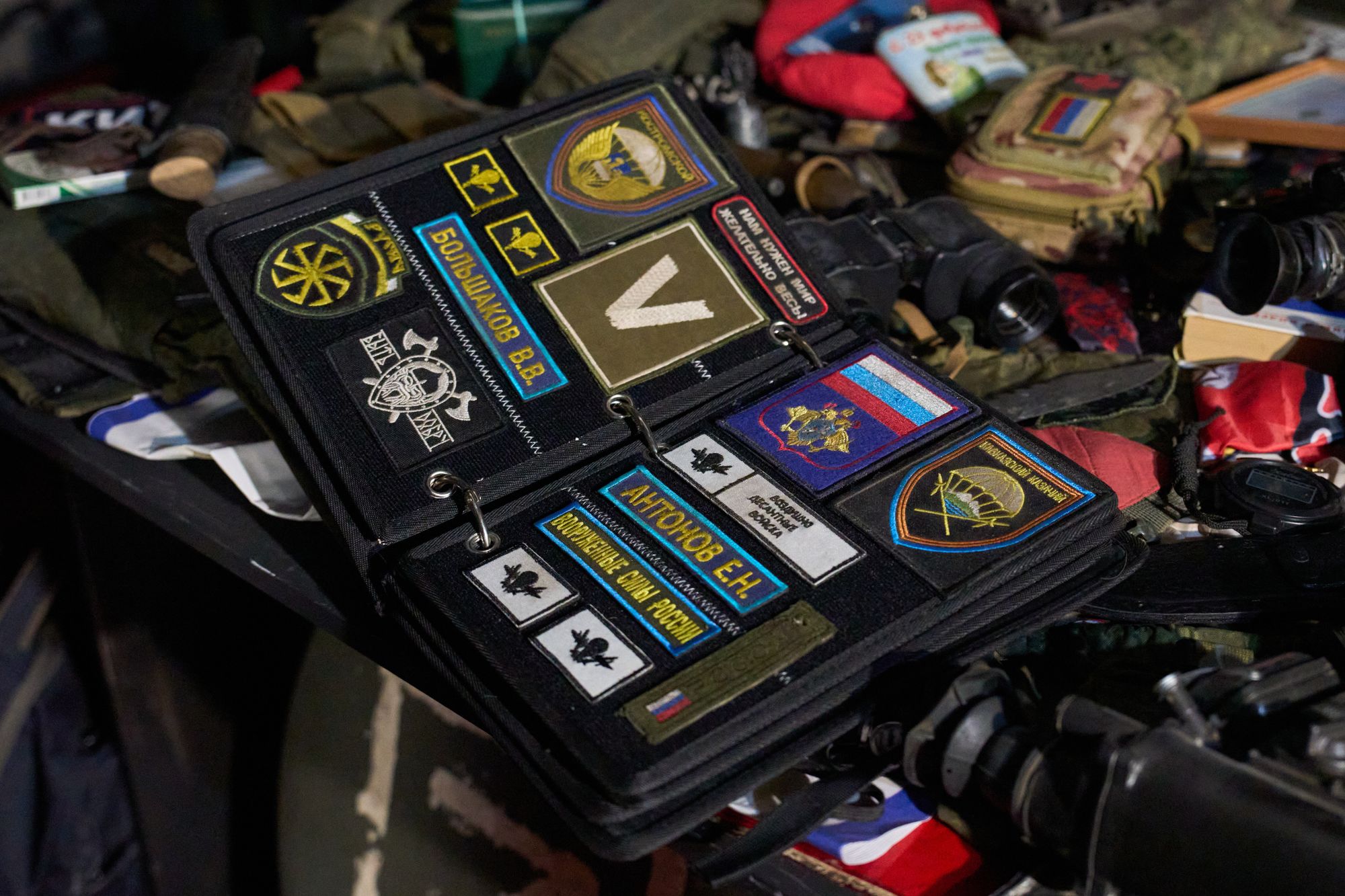 A Russian officer's bag with military patches is displayed in Maxim Kilderov's museum