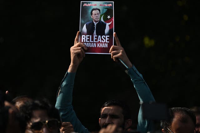 <p>Pakistan Tehreek-e-Insaf (PTI) party supporters protest to demand the release of their jailed leader and Pakistan’s former Prime Minister Imran Khan, in Islamabad on 2 December 2025</p>