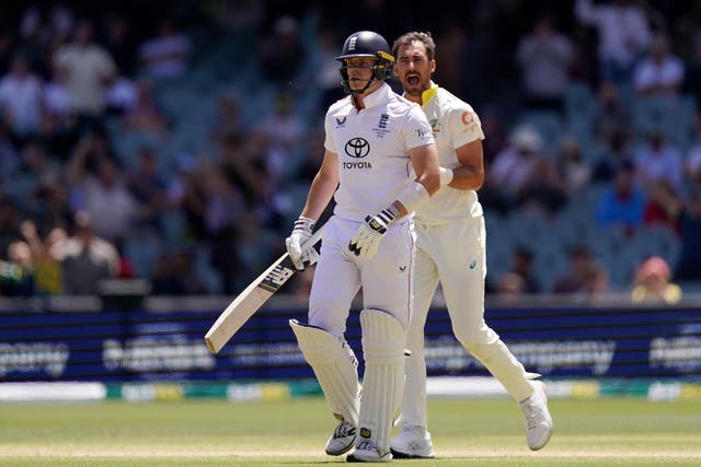 Jamie Smith (left) walks off the ground after being dismissed by Australia’s Mitchell Starc (right) (Robbie Stephenson/PA)