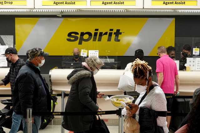 <p>Two Spirit Airlines employees face charges of theft over a $500 Louis Vuitton wristlet that a passenger at Fort Lauderdale-Hollywood International Airport left behind</p>