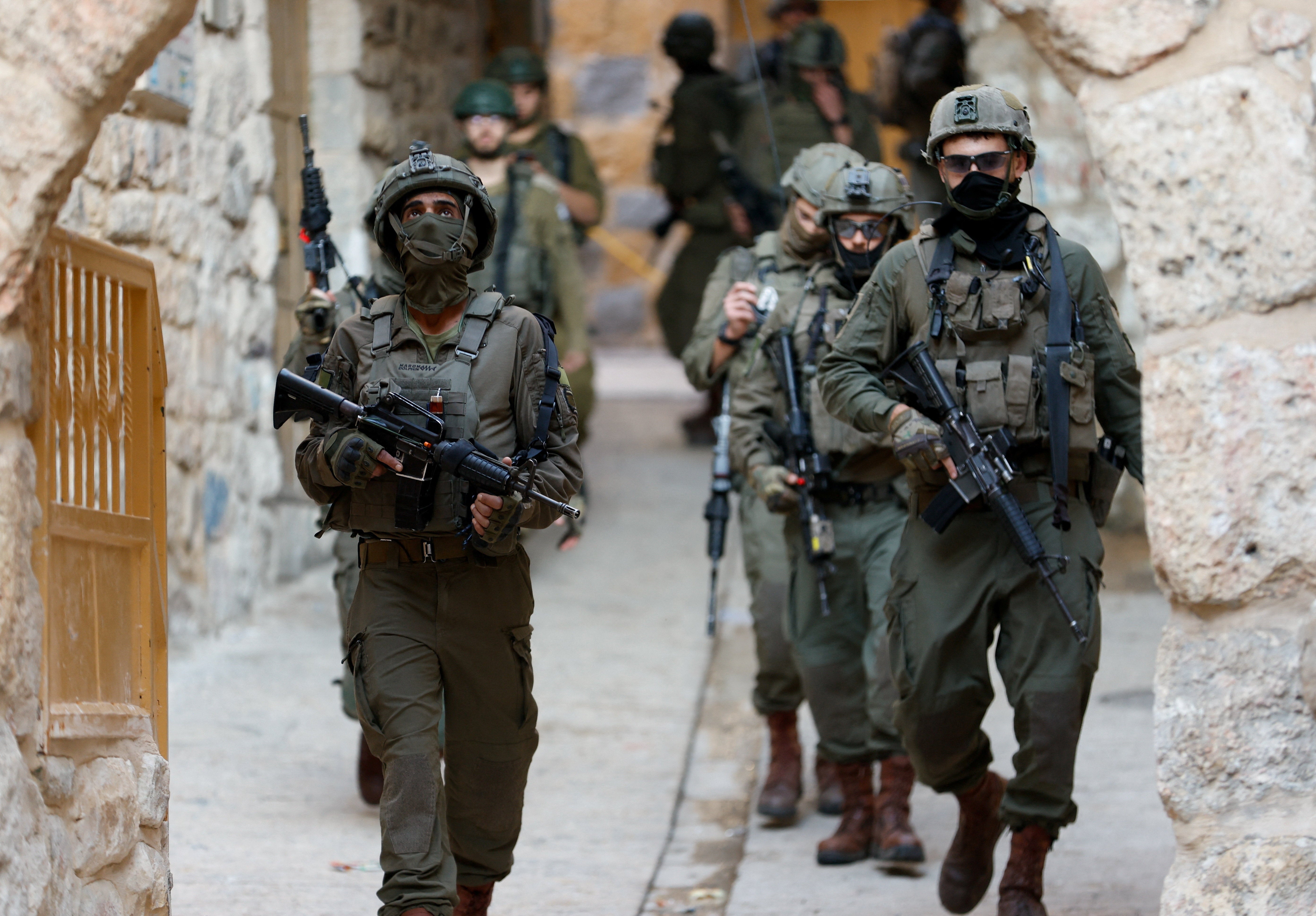 Israeli soldiers during a weekly settlers' tour in Hebron, in the Israeli-occupied West Bank