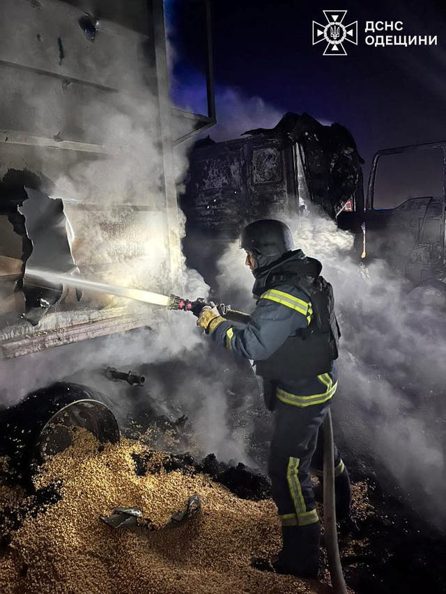 <p>A firefighter works at the site of a Russian missile and drone strike in Odesa</p>