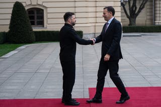 Ukraine's President Volodymyr Zelenskyy, left, shakes hands with Portuguese Prime Minister LuÃs Montenegro in Kyiv
