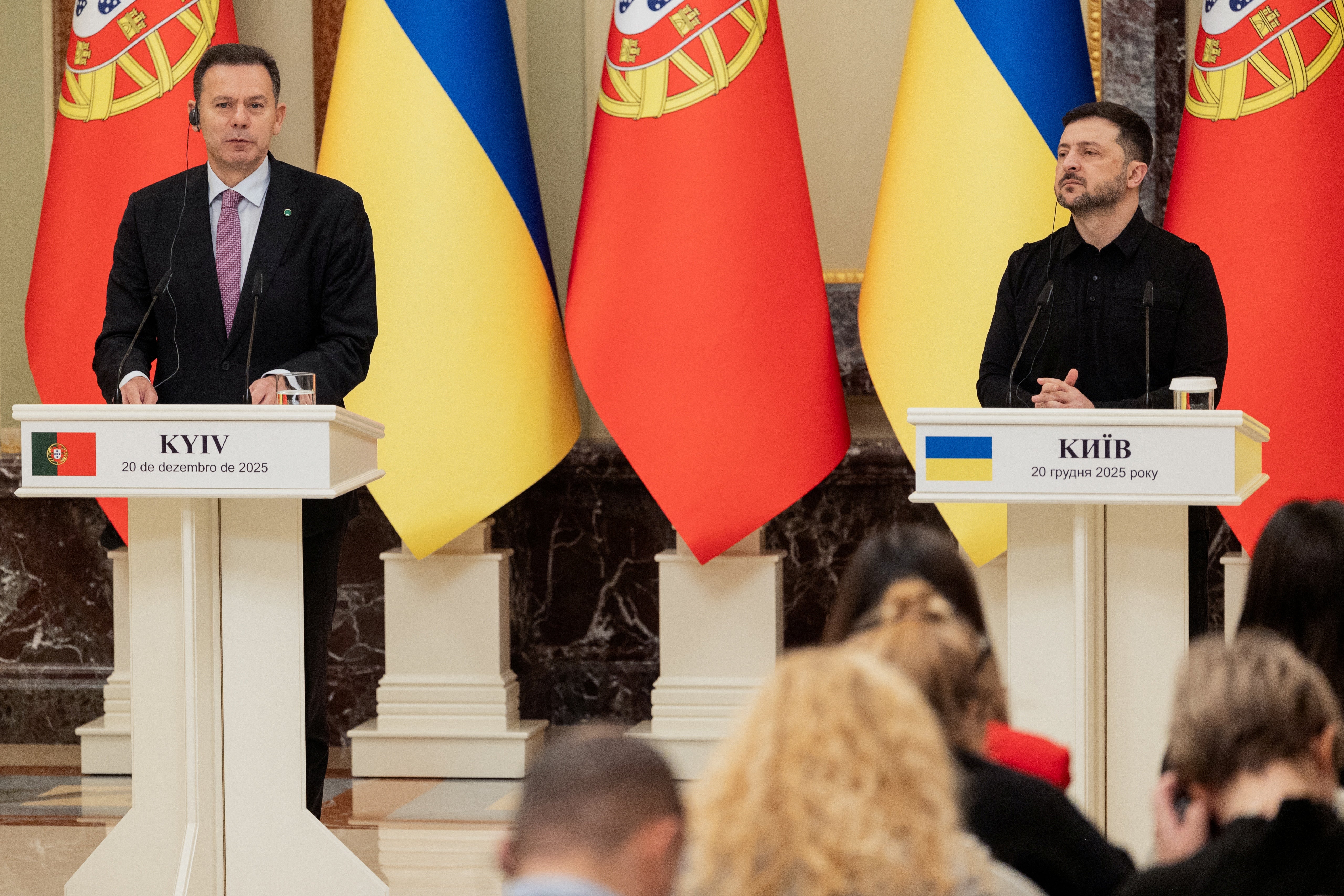 Ukraine's President Volodymyr Zelensky (R) and Portugal's Prime Minister Luis Montenegro (L) speak during a joint press conference in Kyiv
