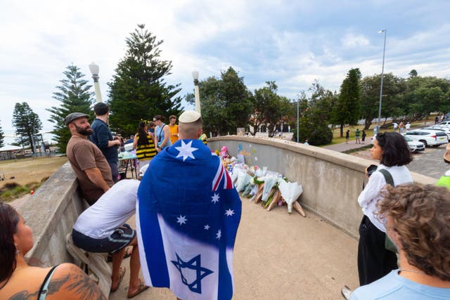 <p>A vigil held on the footbridge at Archer Park on Sunday</p>