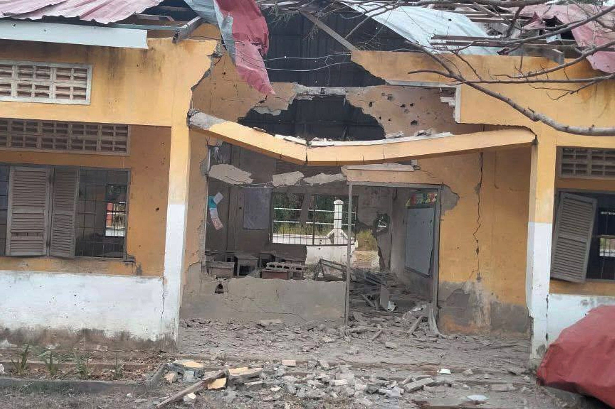 <p>A damaged school is seen after a Thai bombing in Serei Sophaon, provincial town of Banteay Meanchey Province, Cambodia, Thursday</p>
