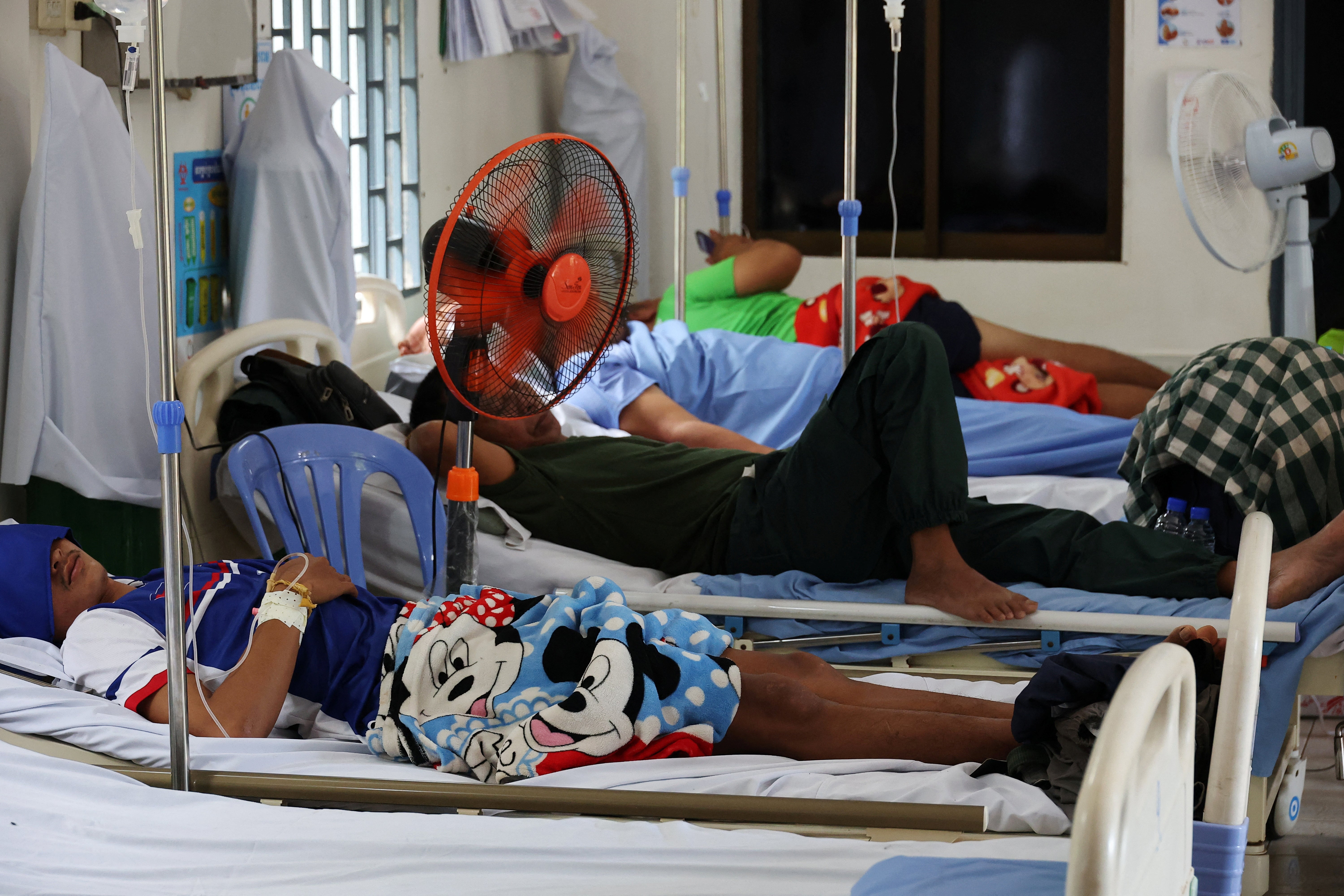 Cambodian soldiers injured on the frontline are hospitalized at Serei Sophon referral hospital, amid clashes between Thailand and Cambodia along a disputed border area, in Sisophon district, Banteay Meanchey Province, Cambodia