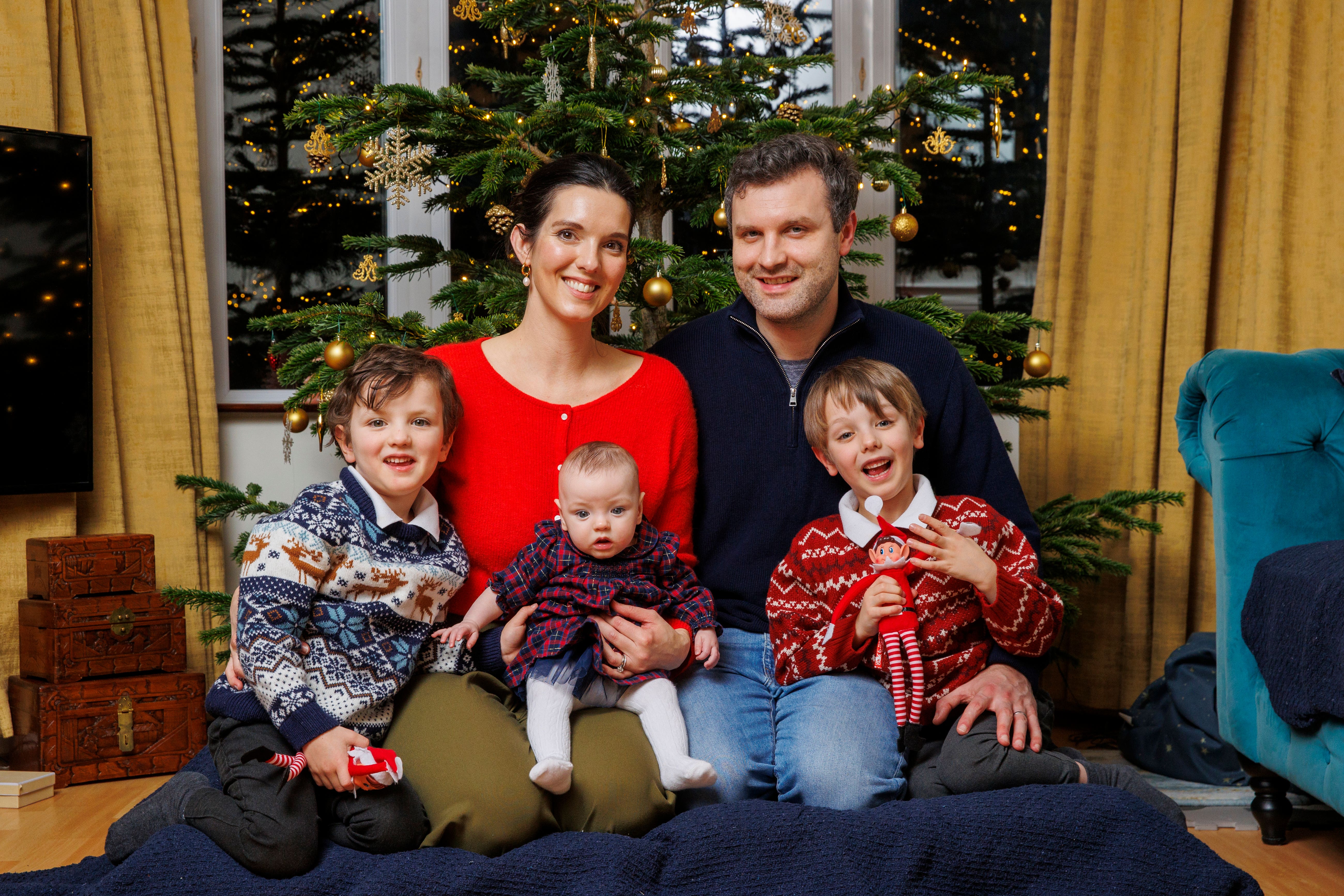 Marie Louise and Jaimie Coburn, with their daughter Fiadh, who was born in April at 25 weeks, and sons Max and Alex at their family home in east Belfast (Liam McBurney/PA)