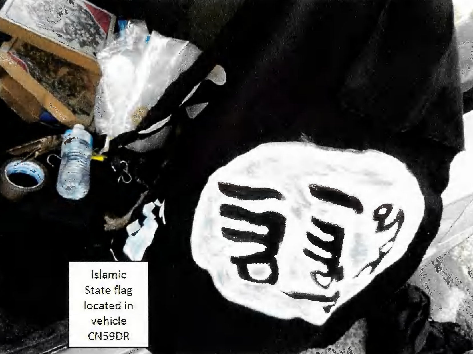 Handout photo of one of two home-made painted Isis flags found in the vehicle used by Sajid and Naveed Akram