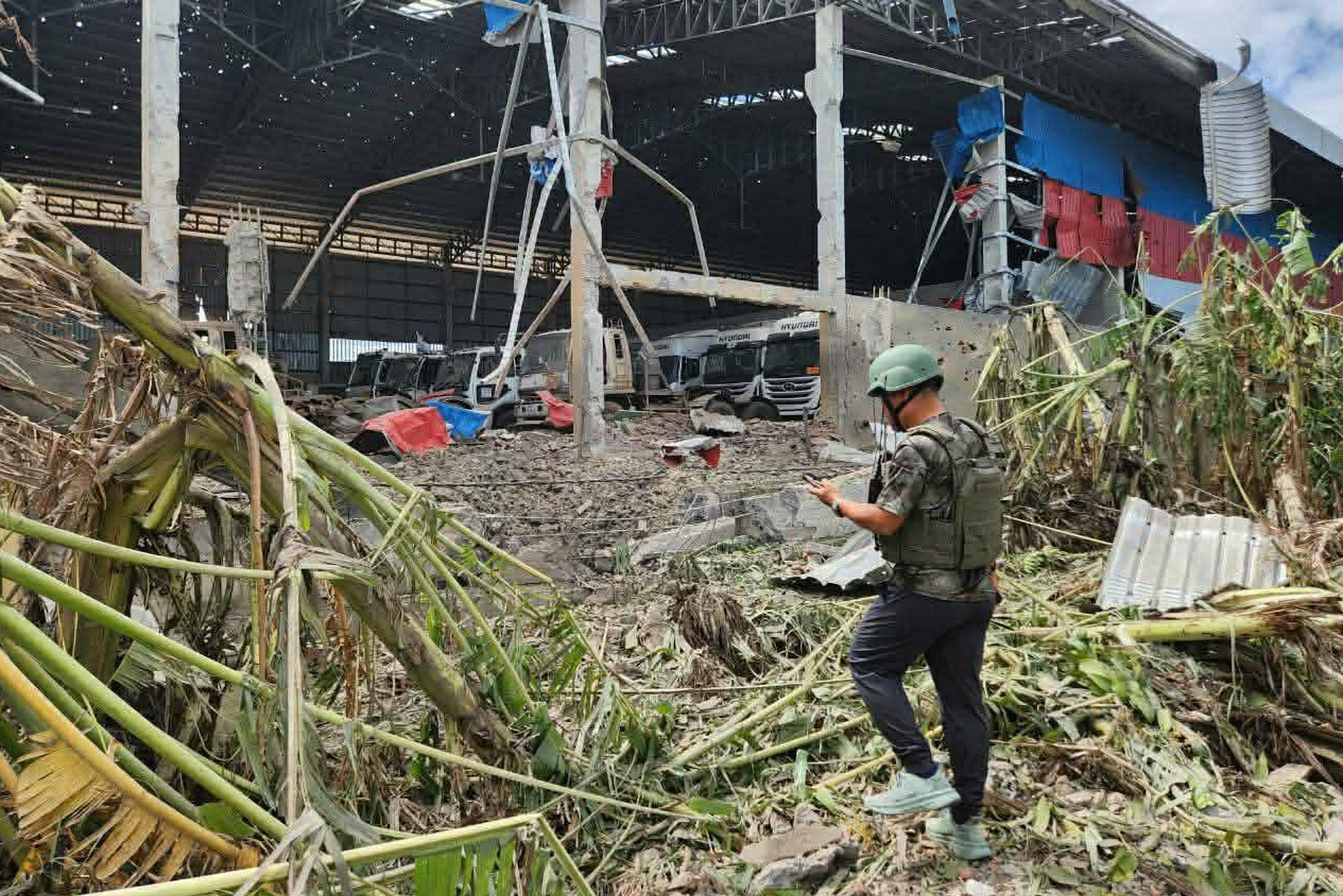 In this photo released by Agence Kampuchea Press (AKP), a distraction building is seen after a Thai bombing in Poipet town, Banteay Meanchey Province, Cambodia
