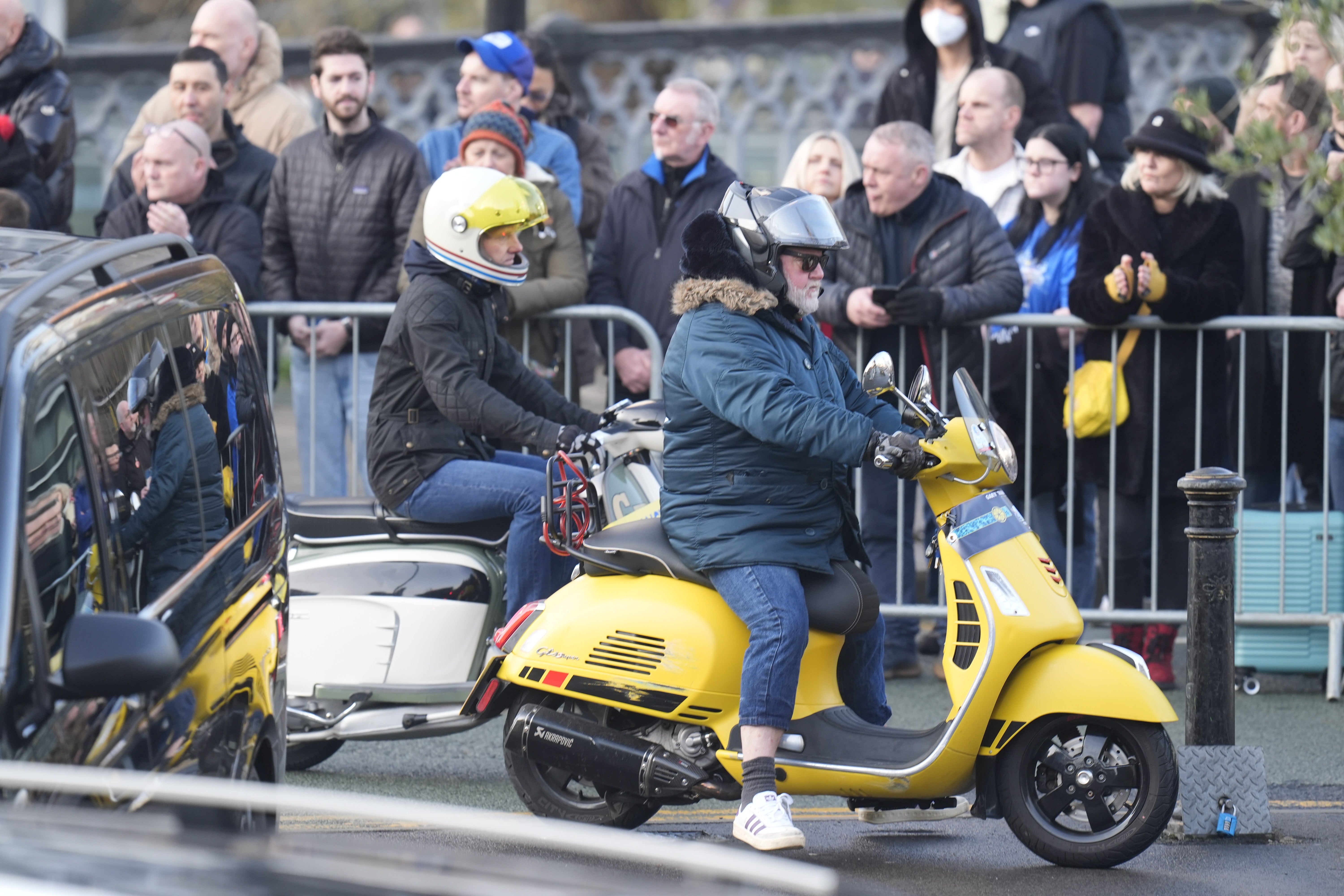 Mods on scooters escort the cortege to the funeral service