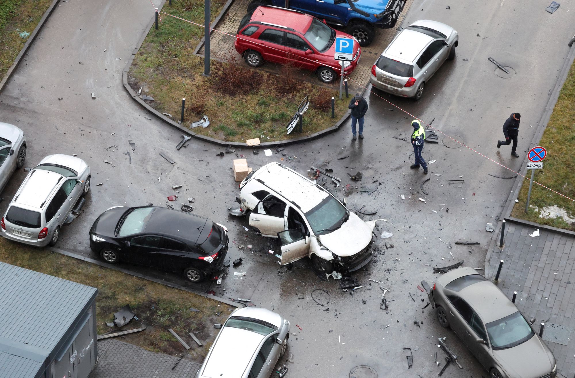 The damaged Kia Sorento lies at the scene where Lieutenant General Fanil Sarvarov, head of the Russian General Staff's army operational training directorate, was killed in a car bomb last December