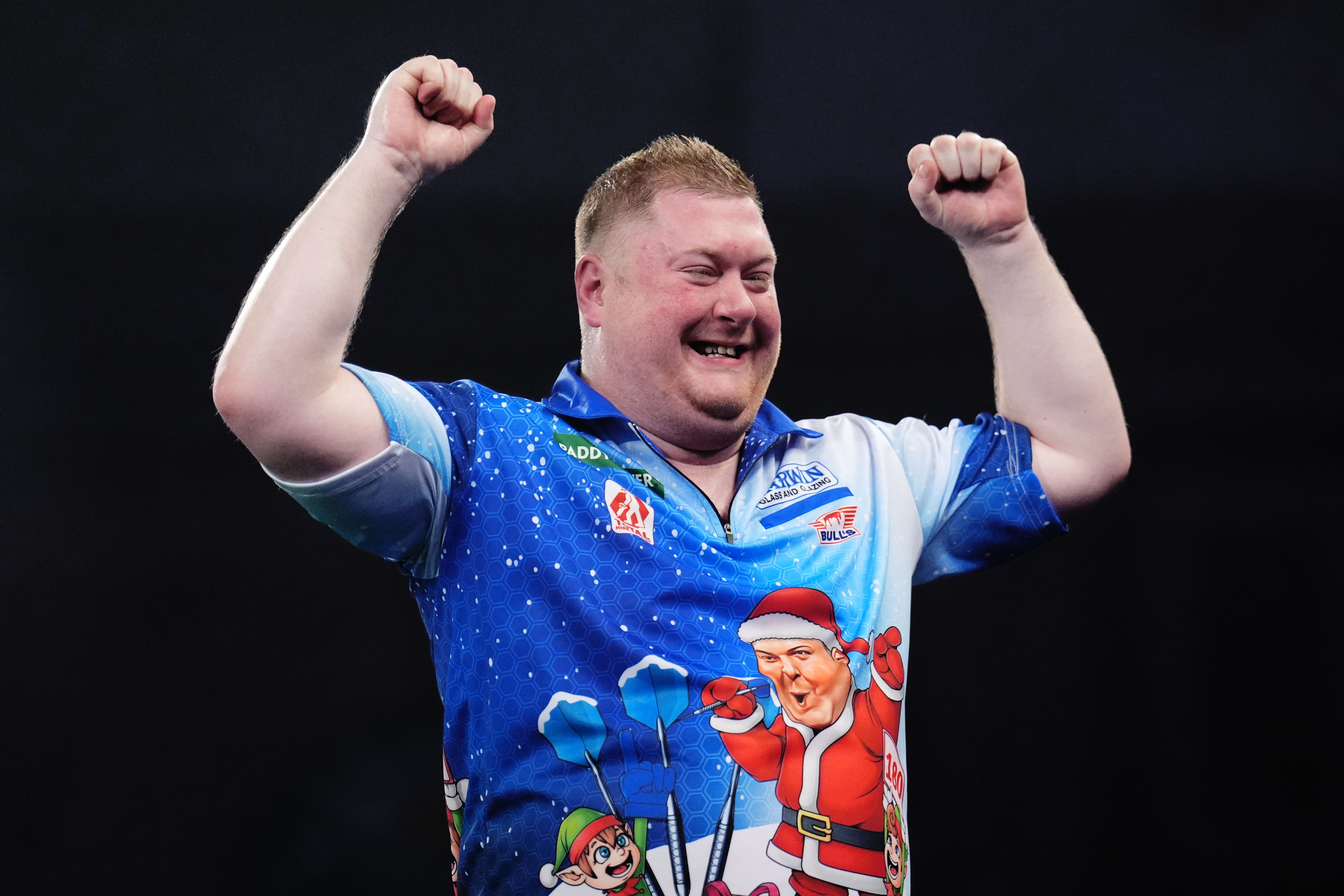 Ricky Evans celebrates defeating seventh seed James Wade at the PDC World Championship (John Walton/PA)