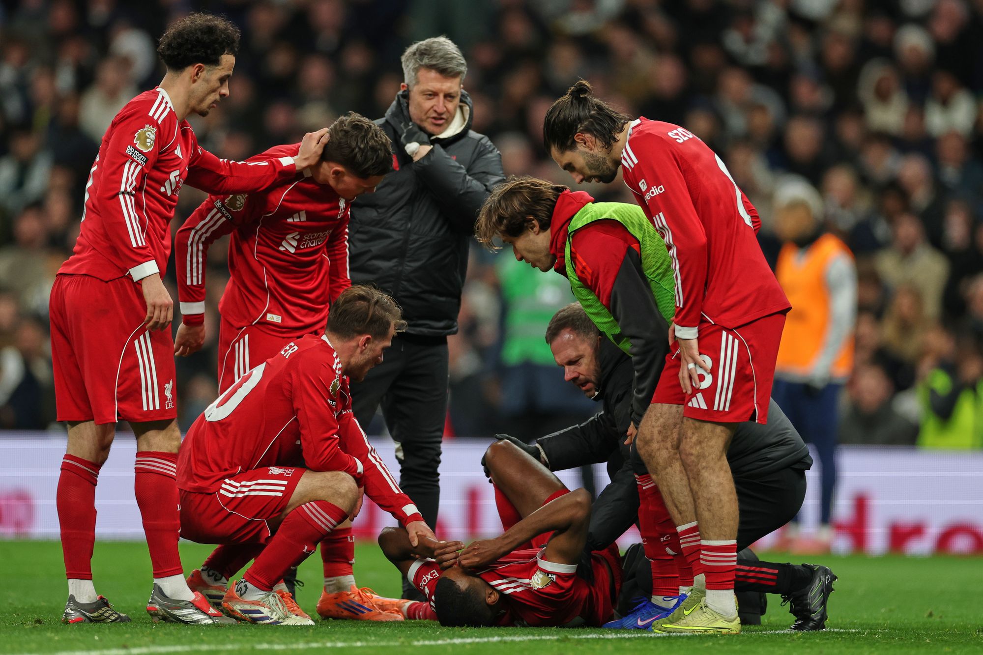 Isak’s team-mates reacted with concern as the Liverpool forward then hobbled off the pitch