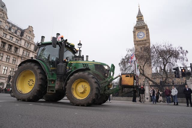 A tractor is driven through Parliament Square (PA)