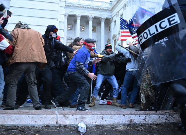 <p>Trump supporters clash with police and security forces, as they storm the US Capitol in Washington, DC, on January 6, 2021</p>