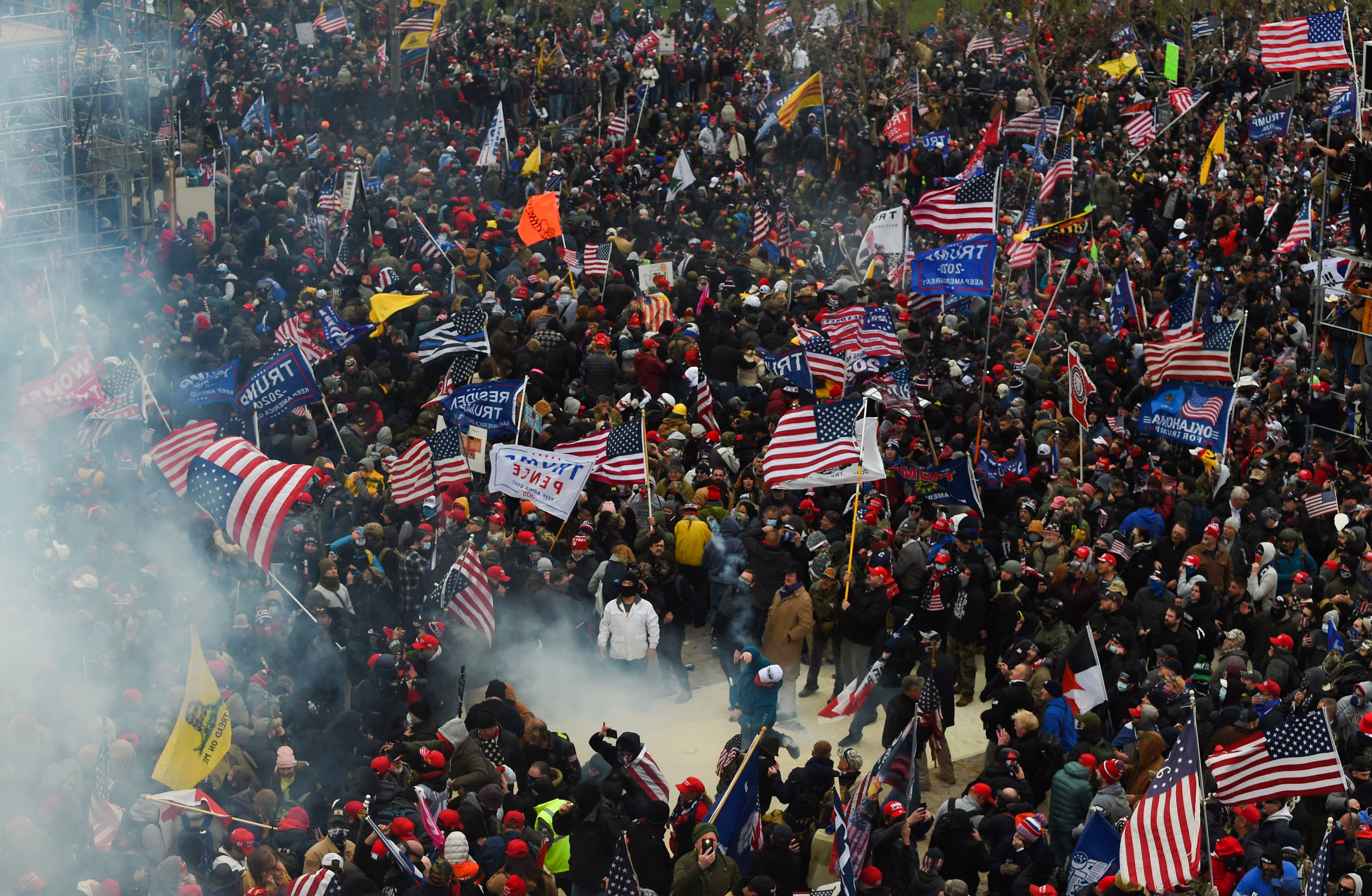 Trump supporters clash with police and security forces as they storm the US Capitol in Washington D.C on January 6, 2021