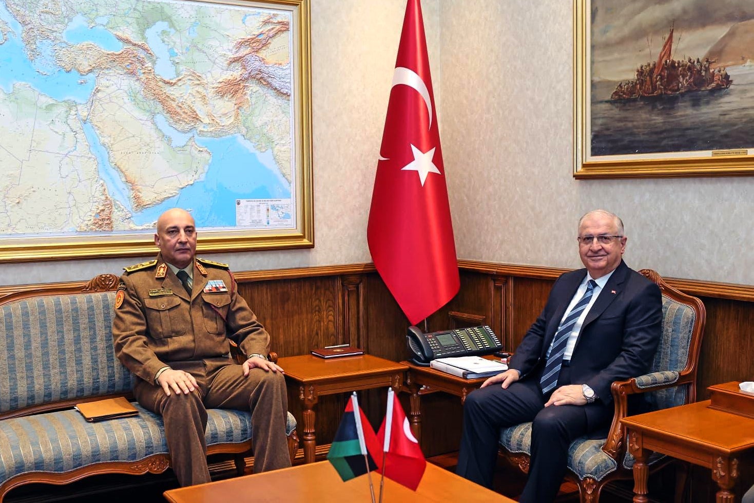 Turkey's Chief of General Staff Gen. Selcuk Bayraktaroglu, right, poses for a photograph with Libyan Chief of General Staff Gen. Mohamed Ali Ahmed El Haddad during their meeting in Ankara, Turkey, Tuesday, Dec. 23, 2025