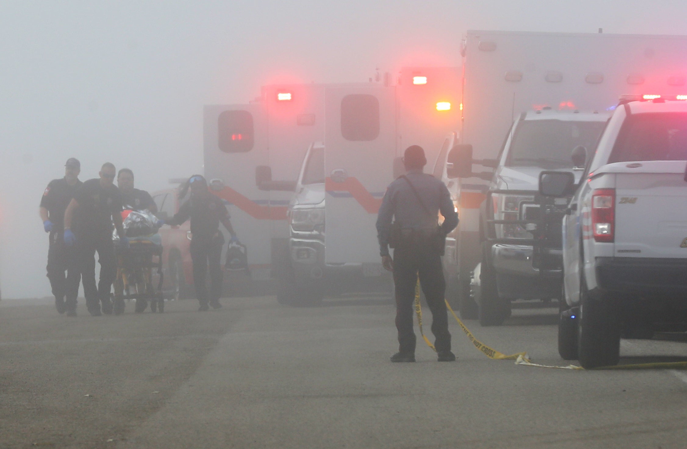 <p>Emergency personnel rush a victim of a small plane crash to an awaiting ambulance, Monday, Dec. 22, 2025, near the Galveston causeway, near Galveston, Texas.</p>