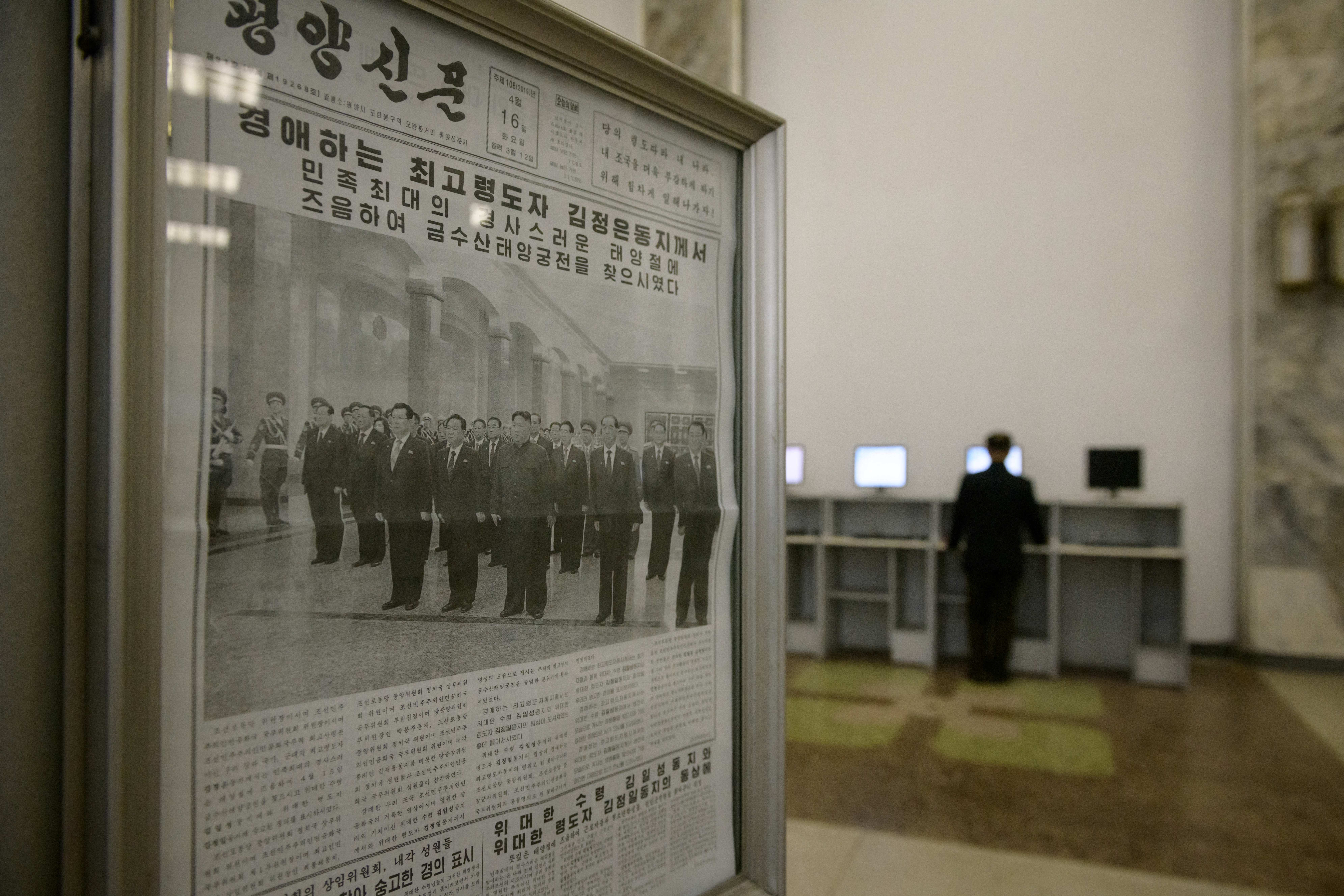 File. A newspaper showing North Korean leader Kim Jong Un is displayed in a lobby of the Grand People's Study House in Pyongyang