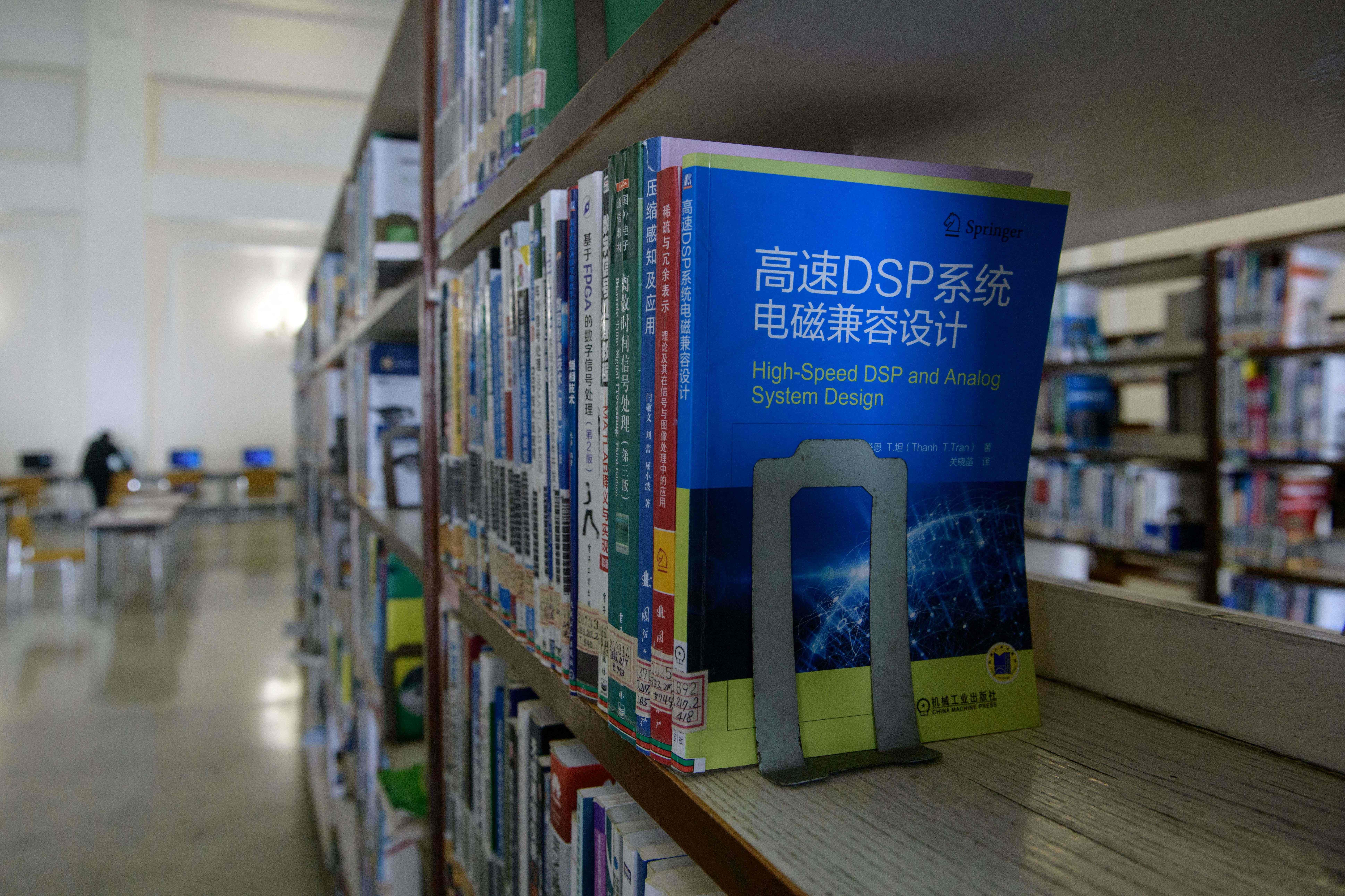 File. Books on internet protocols and computer and mobile phone operating systems are displayed in a library at the Grand People’s Study House in Pyongyang