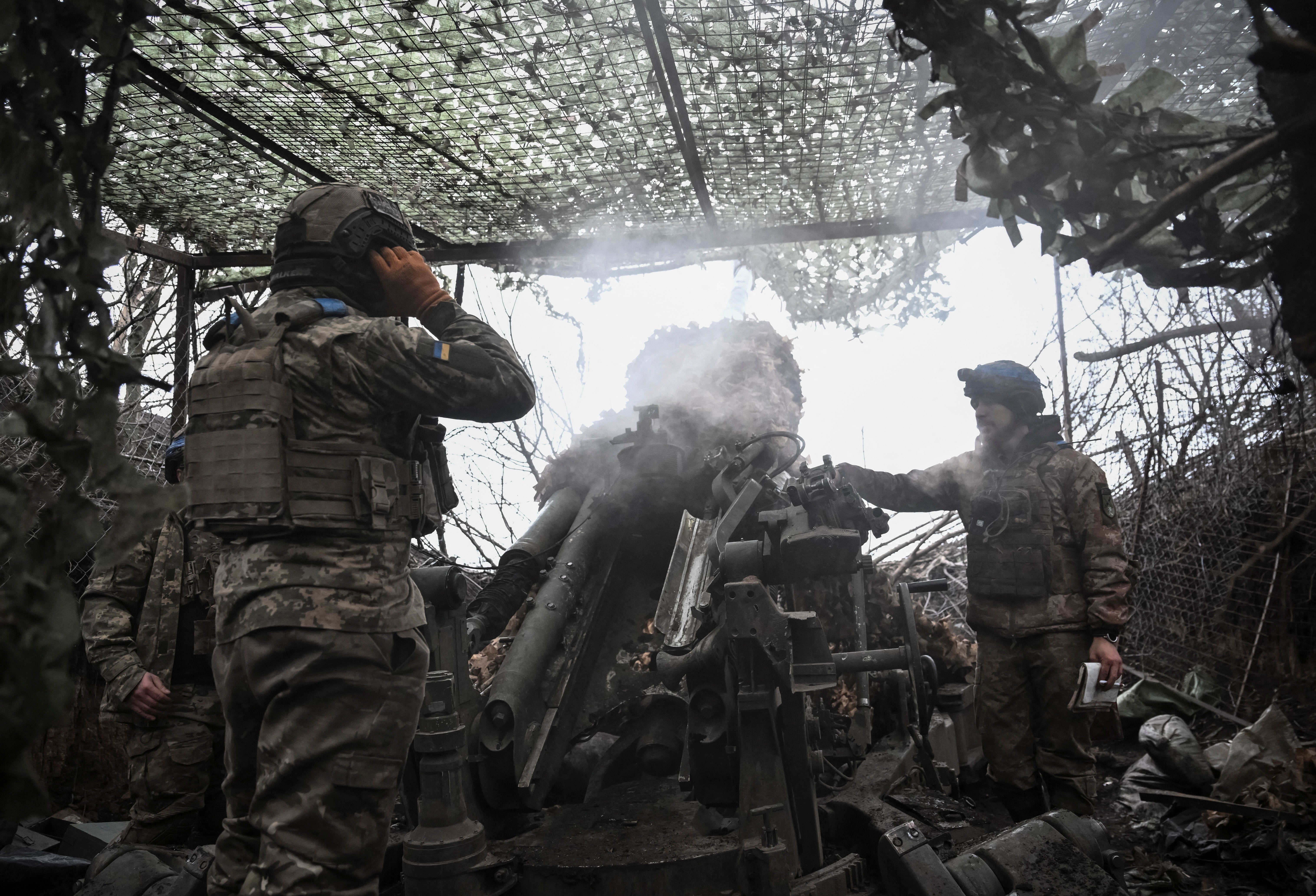 Ukrainian forces fire a M777 Howitzer amid attacks from Russia in the Dnipropetrovsk of Ukraine on Christmas Eve