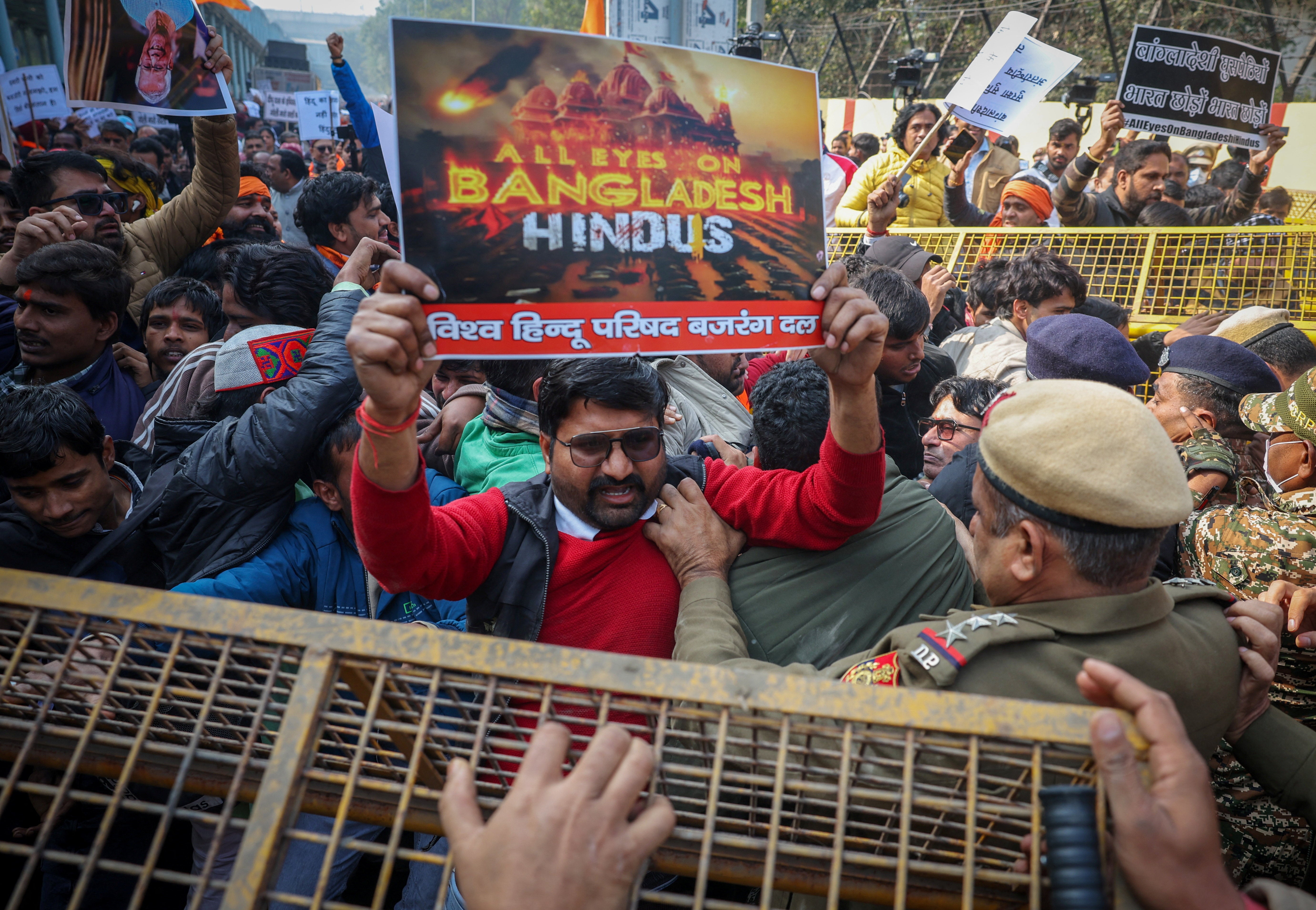 Activists from various Hindu groups scuffle with police during a protest against the lynching of a Hindu man in Bangladesh over allegations of blasphemy last week, near Bangladesh High Commission in Delhi