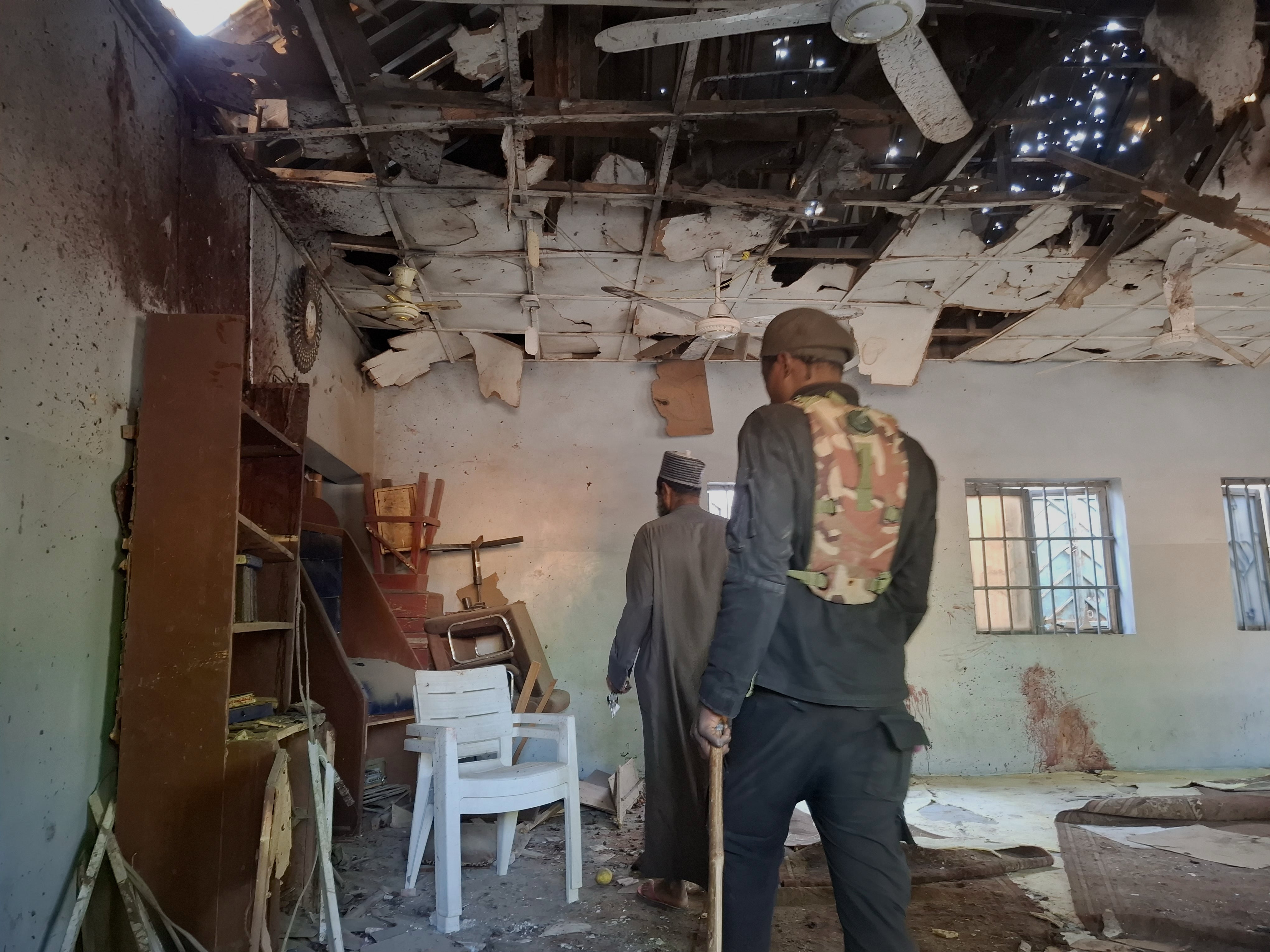 People inspect the scene of a deadly bomb explosion inside a mosque in Maiduguri, Nigeria, Thursday, Dec. 25, 2025. (AP Photo/Jossy Ola)